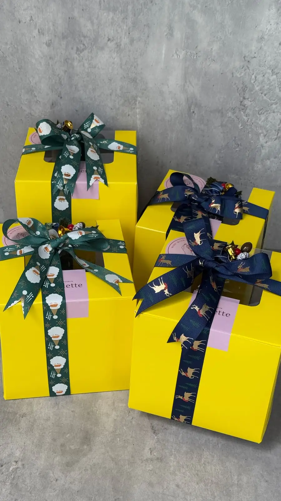 Perlette Cakes gift boxes wrapped with colourful ribbons and ready for festive gifting.